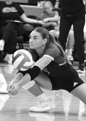 SYDNI HOMOLKA picks up one of her eight digs in Central City’s 3-1 loss to Centura. Homolka finished the match with a team-best sixteen kills. (M. Happ)