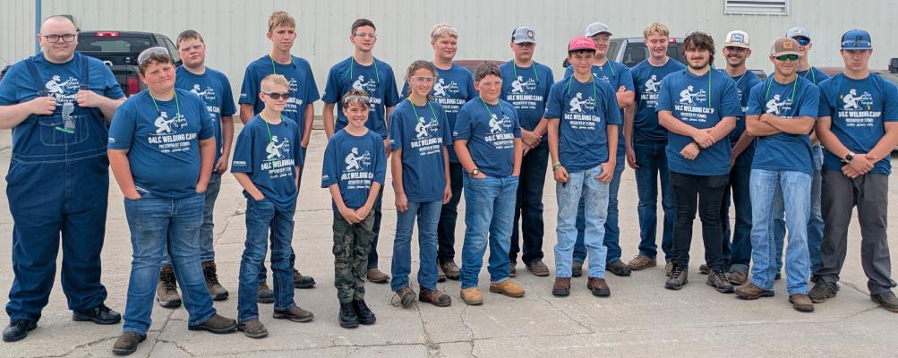 A Spark, An Arc, A Beginning Youth stand outside of Strobel Fabrication on Monday after a tour of the facility. When they were done they also made a tour of Strobel Speed Shop and spent their day welding at Central City High School. (R-N Photo by Grant Brooks)