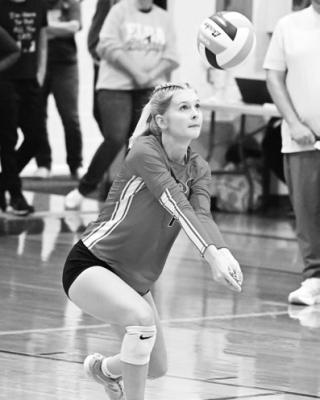 HIGH PLAINS COMMUNITY’S Tessa Morris digs up a pass from Newman Grove/St. Edward last Tuesday night in Elba.