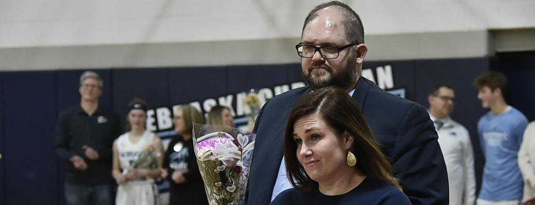 Community Invested This week we spotlight Pastor Clint Chiles who is pictured here on Senior Night at Nebraska Christian with his wife Rachel as they were amongst those who honored their daughter on a special night on the campus of Nebraska Christian.