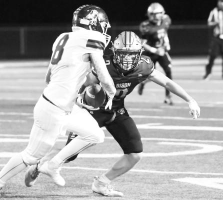 KADEN VAN PELT makes a solo tackle on Adams Central’s Riley Propp during last week’s game in Central City. Photos by Jordan Coslor