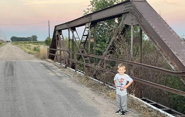 Explore Merrick County During a day out exploring with his father, Elijah Kennedy stops for a photo on one of Merrick County’s aging bridges.