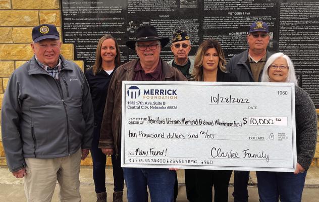 Preserving our Heroes The Clarke Family has stepped up once again to give back to our community and this time to support our local heroes and the Veterans Memorial. Others can donate on Friday during the annual service at the memorial. Front row, Joe, Morgan and Cyndi Clarke present a $10,000 check to American Legion Post #6 with Jack McMahon, Amber Jensen (Merrick Foundation) Rick Kunz and Tom Reimers joining them.