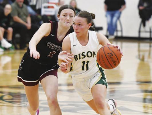 CENTRAL CITY’S AVA CALL drives around Centura’s Kelly Fanta and looks to score in the Bison’s 34-32 victory over the Centurions. Photos by Jordan Coslor