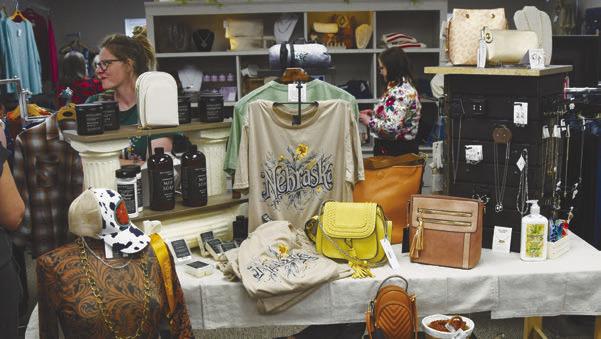 SHOPPERS browse the many items for sale at Magnolias Boutique and Old Dirt Road in downtown Central City during the grand reopening open house. Photo by Jordan Coslor