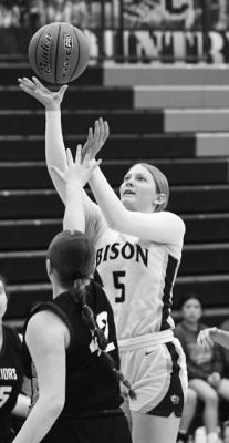JOURNI SCHINDLER drives through the paint and floats it in for two of her thirteen points in Central City’s win over Schuyler. Photo by Jordan Coslor