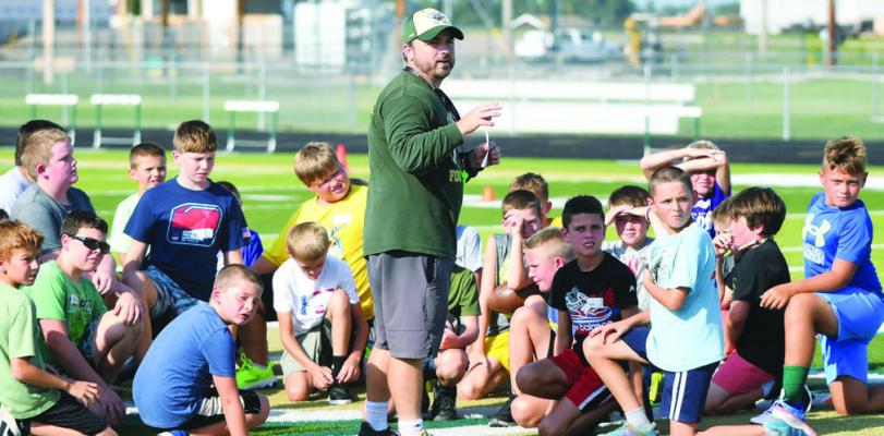 CENTRAL CITY COACH JESSI OWENS welcomes eager Bison football players to the 2026 Bison Youth Camp and gives instructions on the day’s activities at Preferred Popcorn Field. Photos by Jordan Coslor
