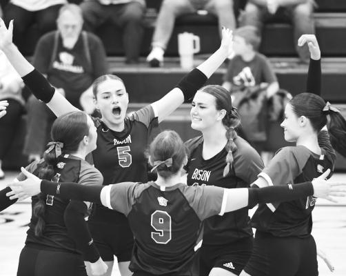 THE CENTRAL CITY volleyball team celebrates after earning a 25-21 win in the second set of their home match with the Thayer Central Titans. (J. Coslor)