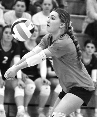 NEBRASKA CHRISTIAN sophomore Katie Sidak digs up a shot from Oakland-Craig during the first set of last week’s district final match against the Knights. Photo by Michael Happ