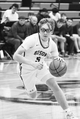 LOGAN VAKINER drives to the basket in Central City’s LouPlatte Conference Tournament game with Wood River last Tuesday evening.