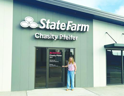 CHASITY PFEIFER with State Farm Insurance is pictured in front of her new office building in downtown Central City. Courtesy Photo