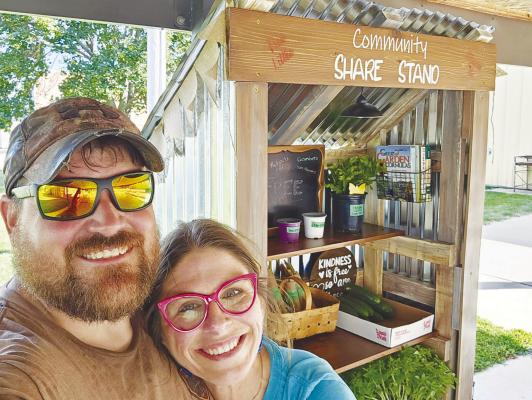 DUSTIN KUFELDT AND SHEENA COBB manage the Clarks Community Share Stand together. Cobb had the initial idea for the project, enlisting the help of her boyfriend to bring it to fruition. Courtesy Photo