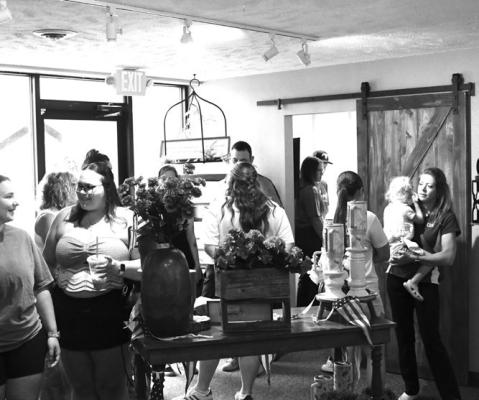 FLOURISH FLORAL CO. held its grand opening during Friday’s Pack the Pavement event, one of the many events that took place during the Lone Tree Days weekend in Central City. A large crowd attended the open house and ribbon cutting for the new business in downtown Central City. Photo by Jordan Coslor