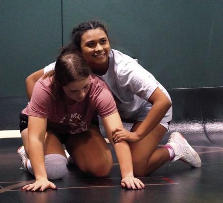 Lady Bison squads look forward to historic December on the hardwood and on the mat