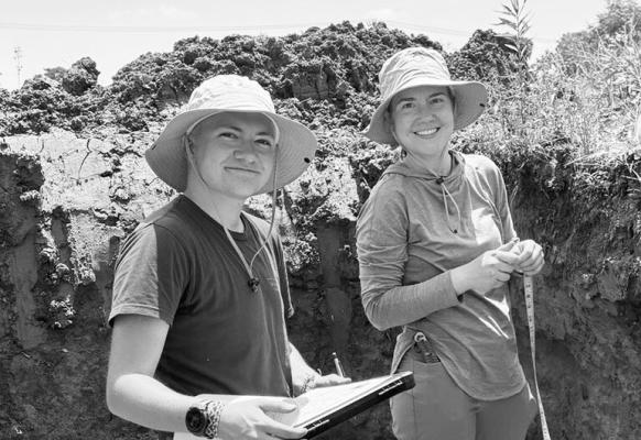 LIZ EROSHENKO, right, and Will Hernández describe a soil judging contest pit. Photo by John Galbraith
