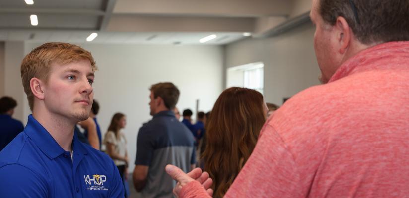 UNK sophomore Dylan Pfeifer meets with a hospital representative during Wednesday’s Hospital Partners Networking Event at the Regional Engagement Center on campus. (Photo by Erika Pritchard, UNK Communications)