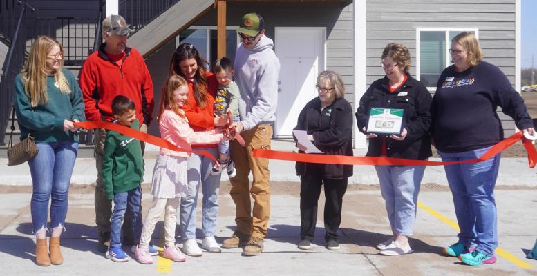 Paul, Janae, and Jordan McHargue and family are joined by members of the Central City Area Chamber of Commerce on Monday for a ribbon cutting as they open the new apartment complex’s in Central City located at Cypress Avenue.