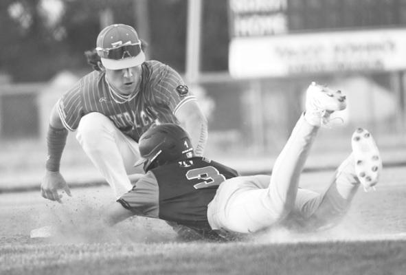 COLBYN PETERS gets the tag down in time, picking off an Aurora baserunner at third base in Tuesday’s game between Central City and Aurora. Photos by Jordan Coslor