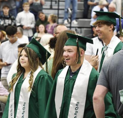 DESIRAE MILLER AND CORBIN KYES exit the Bison Activity Dome during the recessional on Sunday afternoon.