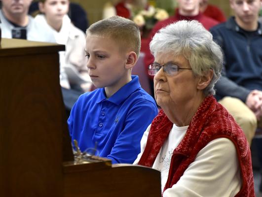 Christmas Kickoff This past Sunday, thanks to the Merrick Country Historical Museum, Sam Johnson and Mrs. Elaine Wischmeier perform at the annual Christmas Tea held in conjunction with the Christmas Under Wraps event.