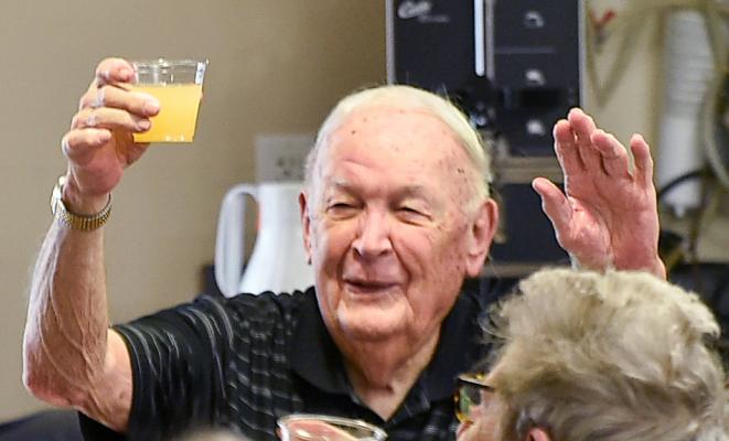 Christmas Toast Monday morning seniors at Cottonwood were able to join in on a special Christmas toast, complete with mimosas for those who wanted them. Jerry Rainforth happily raises his glass to thank those who came.