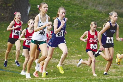 CENTRAL CITY’S AMELIA BUHLKE races away from the start of Friday’s NSAA Class C State Cross Country Championships. The Central City junior placed fourth at the state meet, running the course in 19:49. Photos by Michael Happ