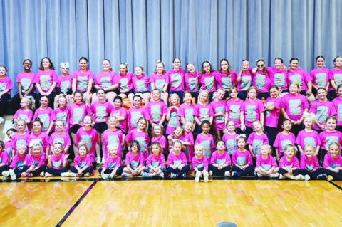 THE PALMER CHEERLEADERS held their annual mini cheer camp on Friday, October 9th. Seventy-five preschool and elementary aged students joined the cheer team for a halftime performance to “Girls Just Wanna Have Fun” followed by group cheers. Courtesy Photo