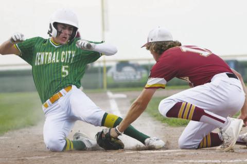 LUKE MCHARGUE attempts to slide past the tag from Centura’s Barrett Fries early in the Battle of the Kernels last Thursday in Central City. Photos by Jordan Coslor