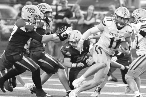 TURNER HANKE runs through multiple Kearney Catholic defenders on the way to a big gain in Central City’s 26-14 win last Friday. Photos by Michael Happ