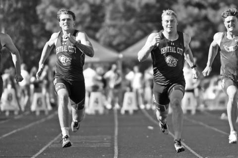 WYATT DENT AND TURNER HANKE sprint to the finish line in the 100-meter dash at the B-5 District Meet in Central City. Dent and Hanke secured first and second place finishes in the race to qualify for the state championships. Photos by Jordan Coslor