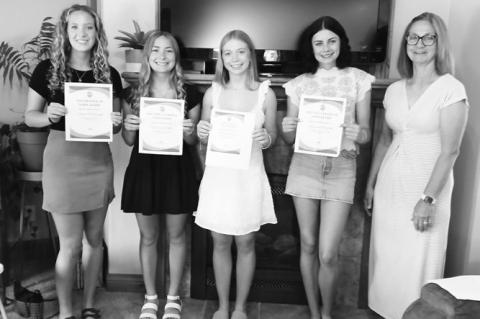SCHOLARSHIP RECIPIENTS that were recently recognized included Rylee Hoffman, Hailey Weller, Emma Brandes, Reagan Fousek, and Scholarship Committee Chairman Karen Benner. Courtesy Photo