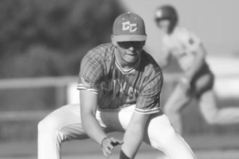 LOGAN VAKINER sees a bunt into his glove, going on to make the throw to first base from the pitcher’s mound.