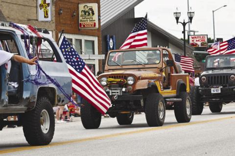 THE AMERICAN FLAG was featured as predominantly as candy and smiles along the Lone Tree Days Parade route in downtown Central City on Saturday morning during this year’s parade. The event was the perfect way for many onlookers to kick off the Fourth of July. Photos by Michael Happ