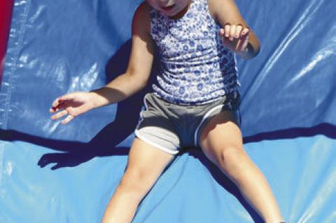 KIDS OF ALL AGES enjoyed the bounce houses and other games during Thursday’s Family Fun Night.