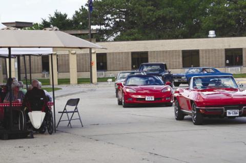 CARS OF ALL MAKES AND MODELS paraded past the residents of Litzenberg Long-Term Care during their Father’s Day barbeque last week. Courtesy Photo