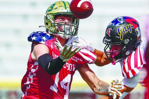 FORMER CENTRAL CITY HIGH SCHOOL STANDOUT Wyatt Dent reaches for a pass while eluding the South team’s coverage during the 68th Annual Shrine Bowl on Saturday afternoon in Kearney. Photos by Jeremy Vauble
