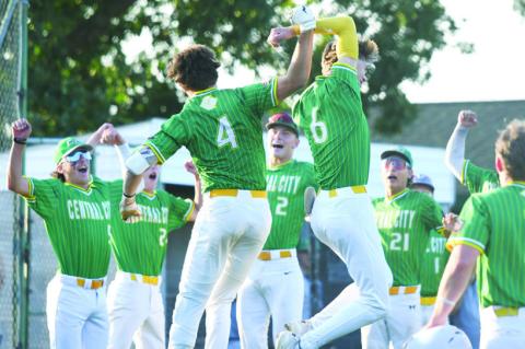THE CENTRAL CITY SENIORS celebrate at home plate after Colbyn Peters’ second-inning home run in their game with West Point on Sunday evening at Kernel Field. Photos by Jordan Coslor