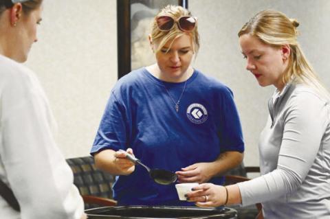 CORNERSTONE BANK AND INSURANCE in Central City took home the voters’ choice for the best soup last Thursday. Pictured serving up the soup are Whitney Wall and Mikaela Stuart. Photo by Michael Happ