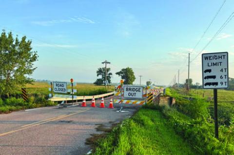 A TIMBER BRIDGE crossing Prairie Creek on 7th Road just north of O Road buckled sometime before dawn on Saturday. Courtesy Photo