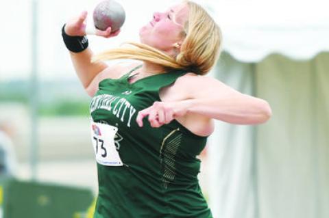 HOPE PAUP competes in the shot put, going on to a third place finish in Class B.