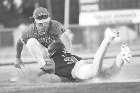 COLBYN PETERS gets the tag down in time, picking off an Aurora baserunner at third base in Tuesday’s game between Central City and Aurora. Photos by Jordan Coslor