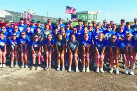MEMBERS of the Palmer High School Marching Band swapped out their band uniforms for blue Sutton Squad t-shirts when performing at the Nebraska State Fair in Grand Island last week. The change was made over concerns due to the extreme heat last Wednesday. Courtesy Photo